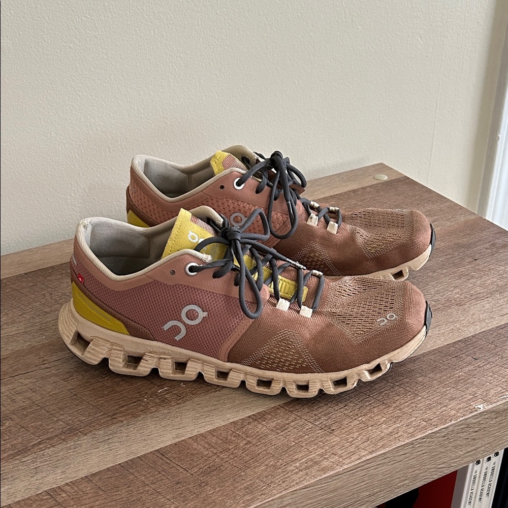 On Running Brown and Yellow Athletic Shoes